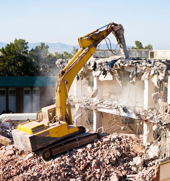 demolishing a building using an excavator 2 courtland ms